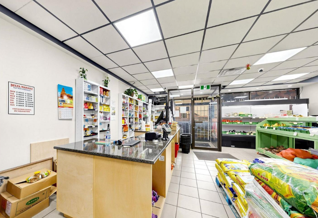 Delta Market checkout counter and shelving